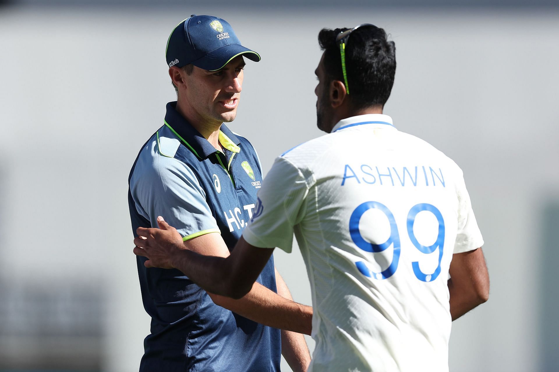 Pat Cummins of Australia shakes hands with Ravichandran Ashwin of India at the end of the match on day four of the First Test match in the series between Australia and India at Perth Stadium on November 25, 2024 in Perth, Australia. (Photo by Paul Kane - CA/Cricket Australia via Getty Images)